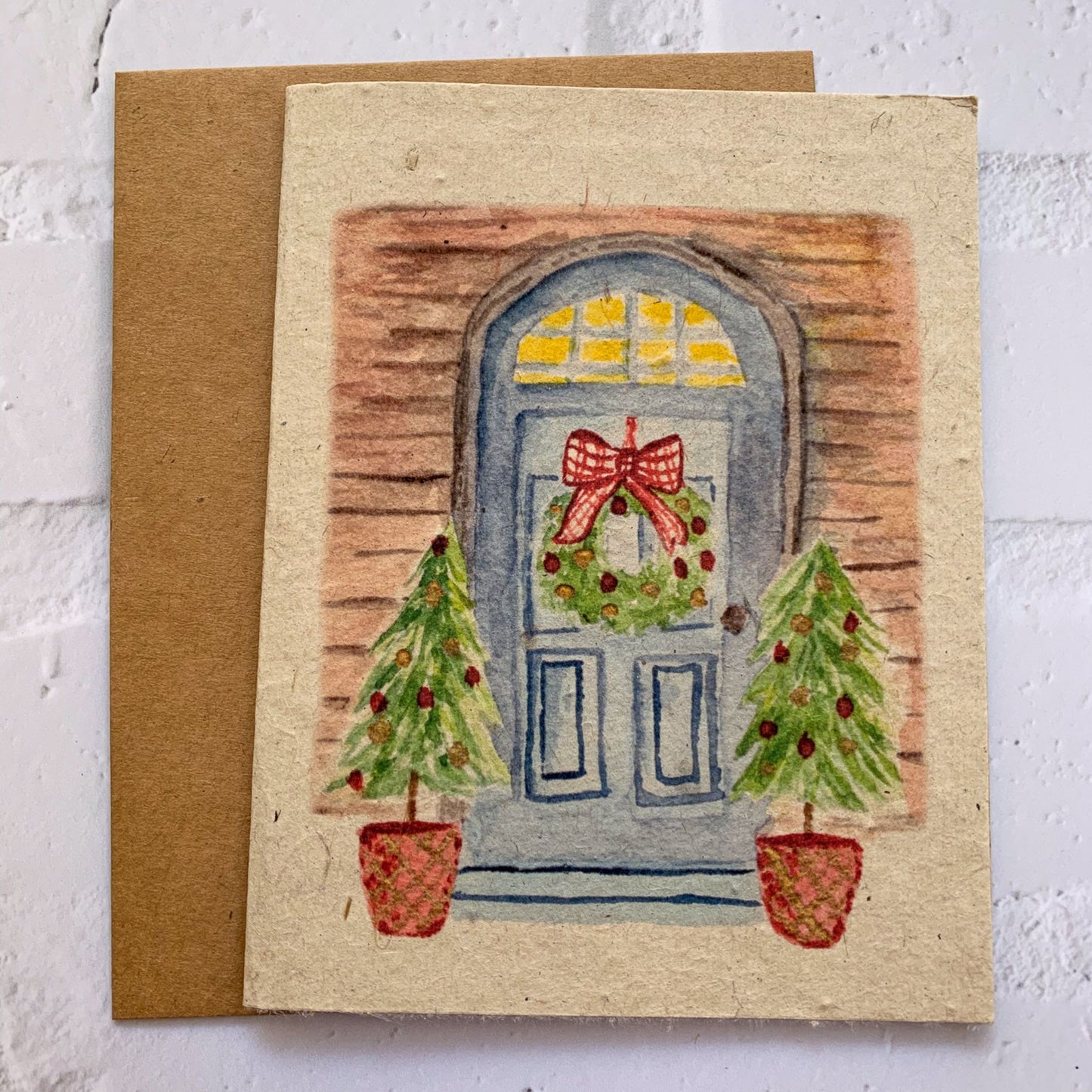 door with wreath and Christmas trees eco friendly card with kraft envelope
