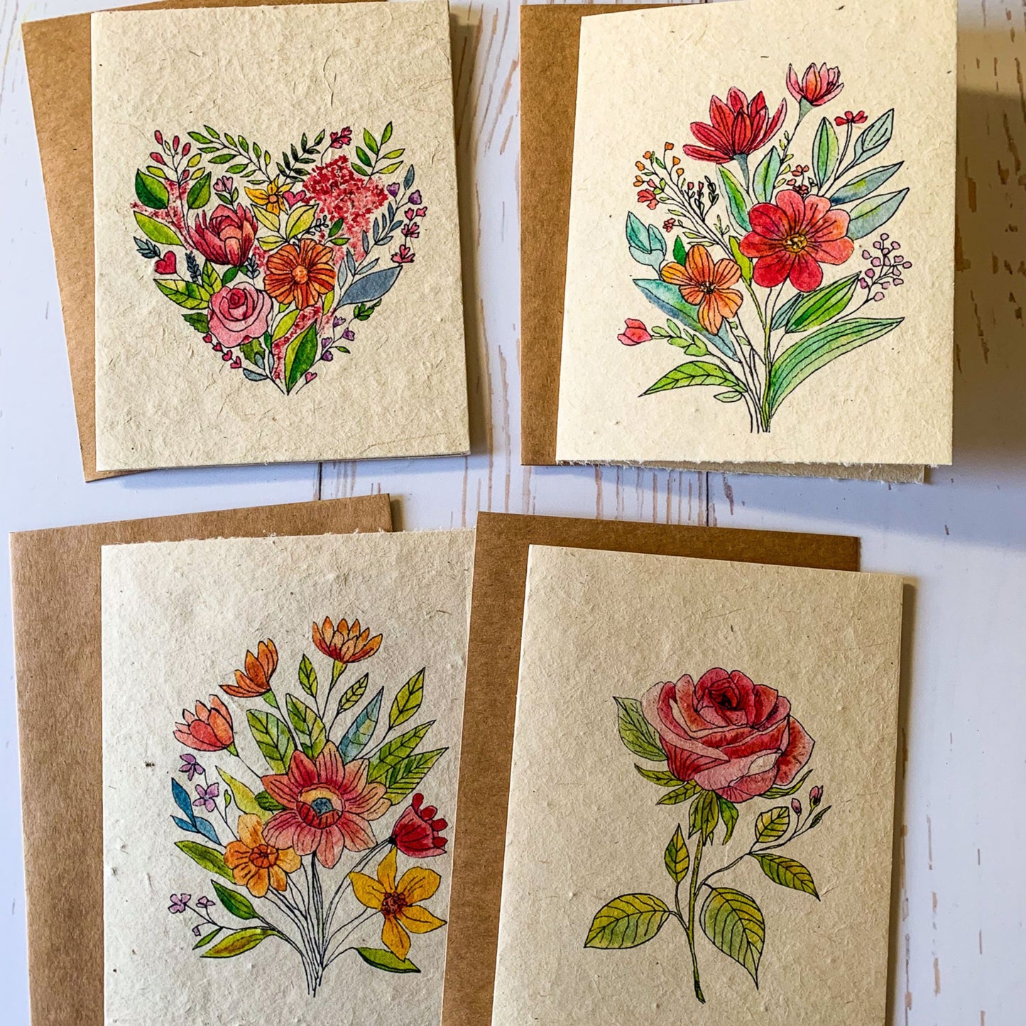 set of four plantable seed paper cards with watercolor flower designs
