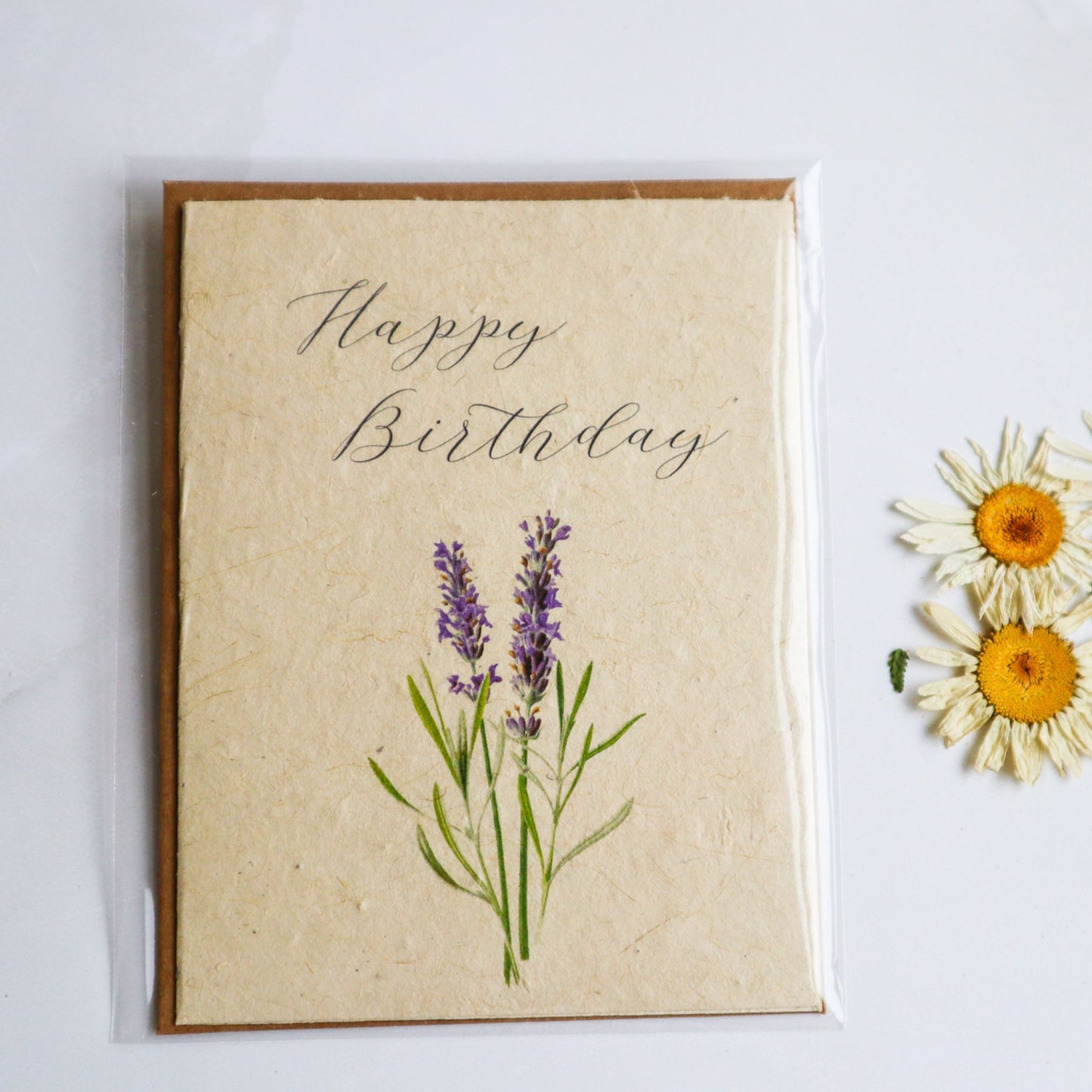 Happy birthday greeting card with vintage purple flowers printed on plantable flower seed paper.