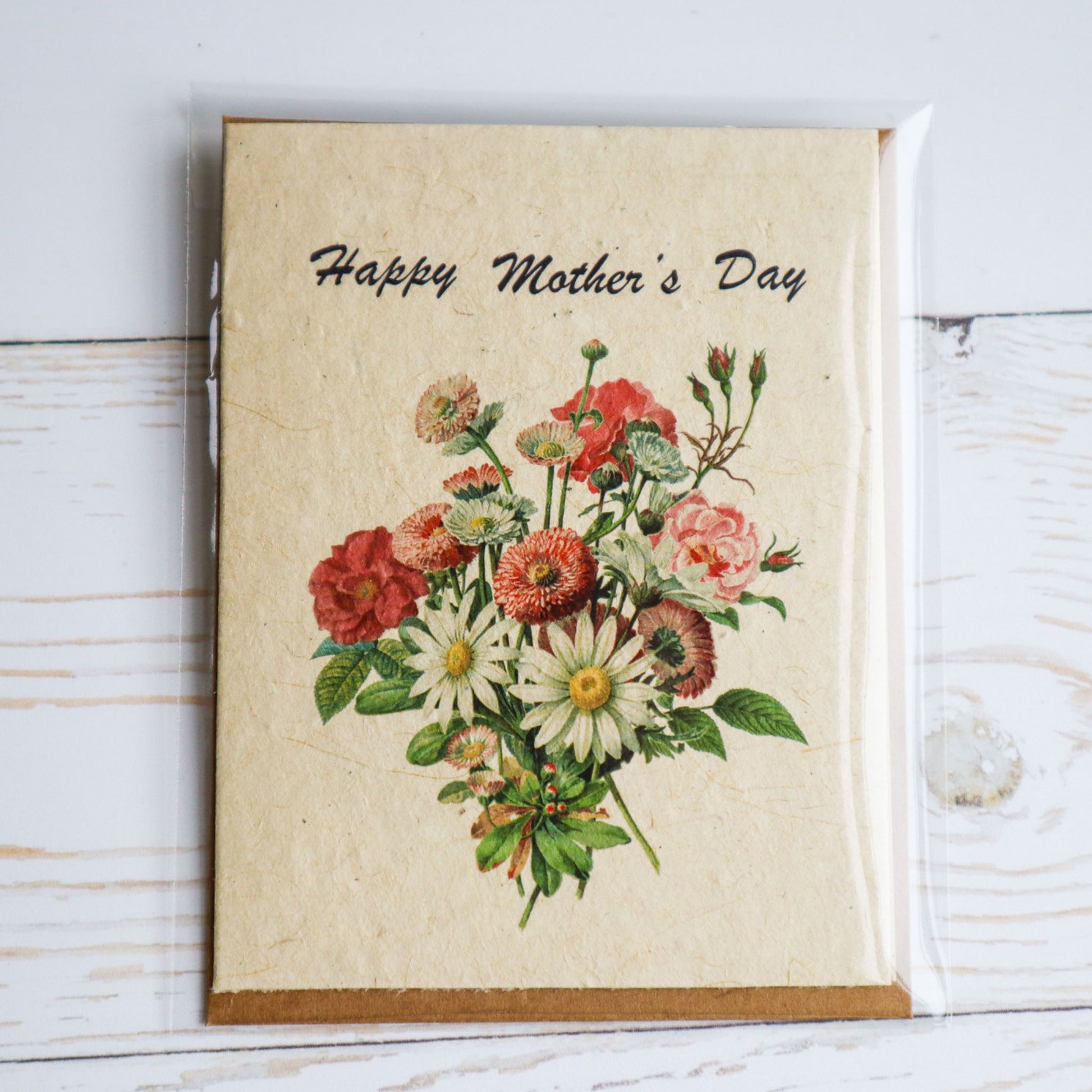 Happy Mother's Day plantable flower seed paper card with floral bouquet and kraft envelope. Comes in biodegradable sleeve.